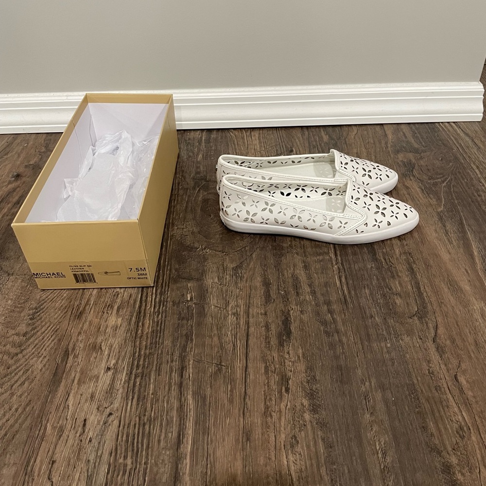 Women’s Michael Kors optic white sneakers in like new condition.